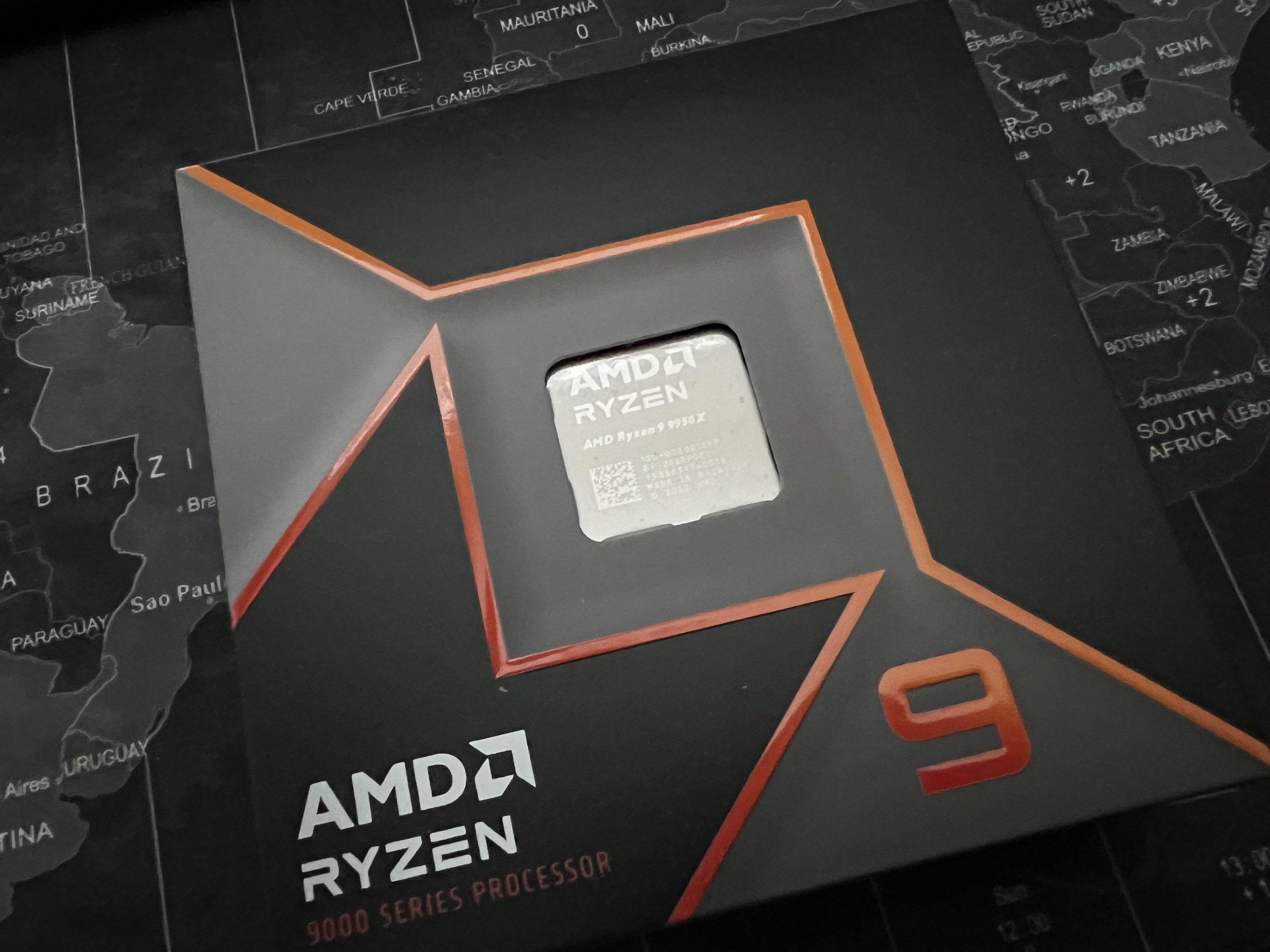 Ryzen 9 9950X retail box on a world-map desk mat