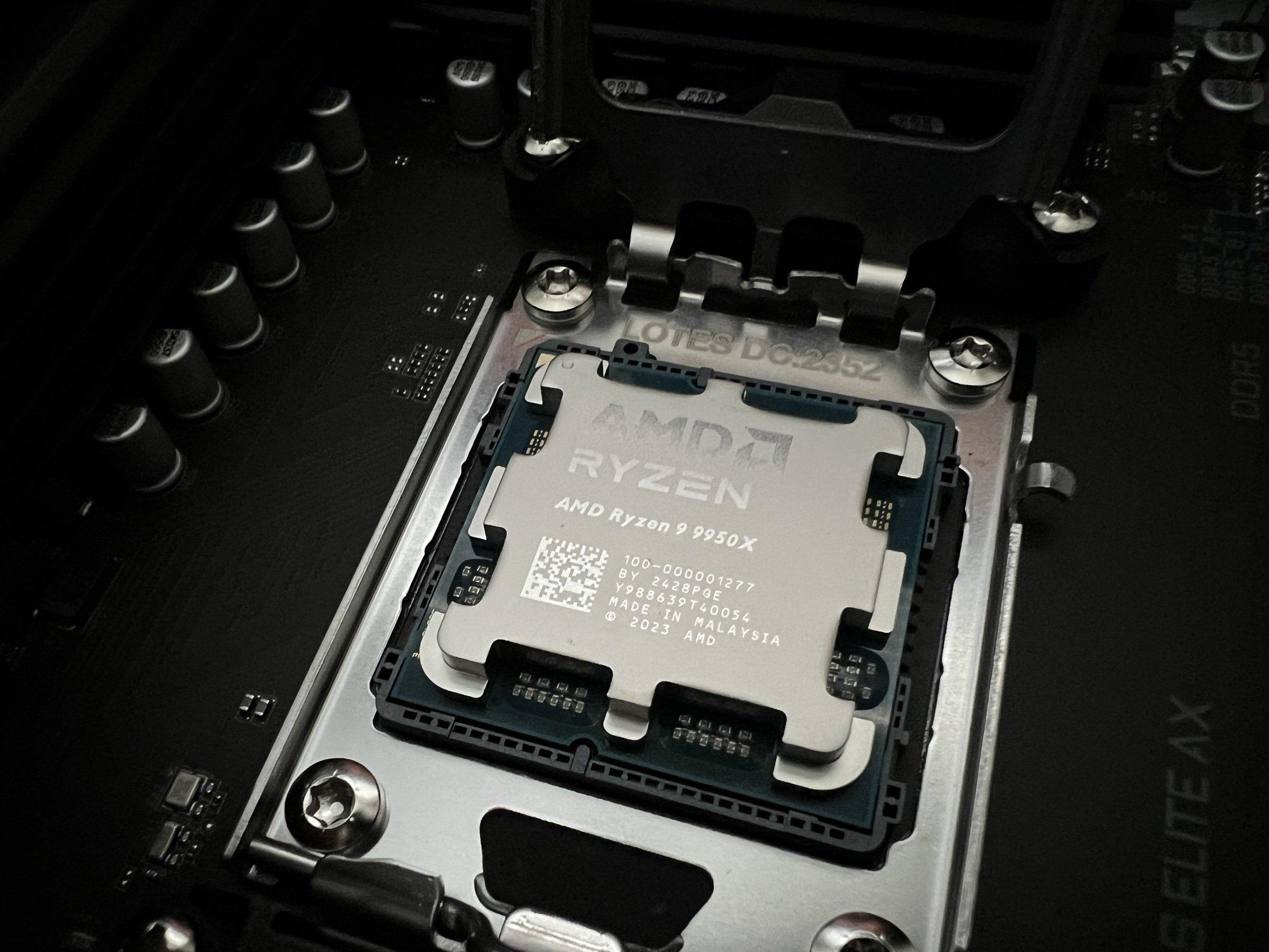 Ryzen 9 9950X seated in the AM5 socket, retention frame open