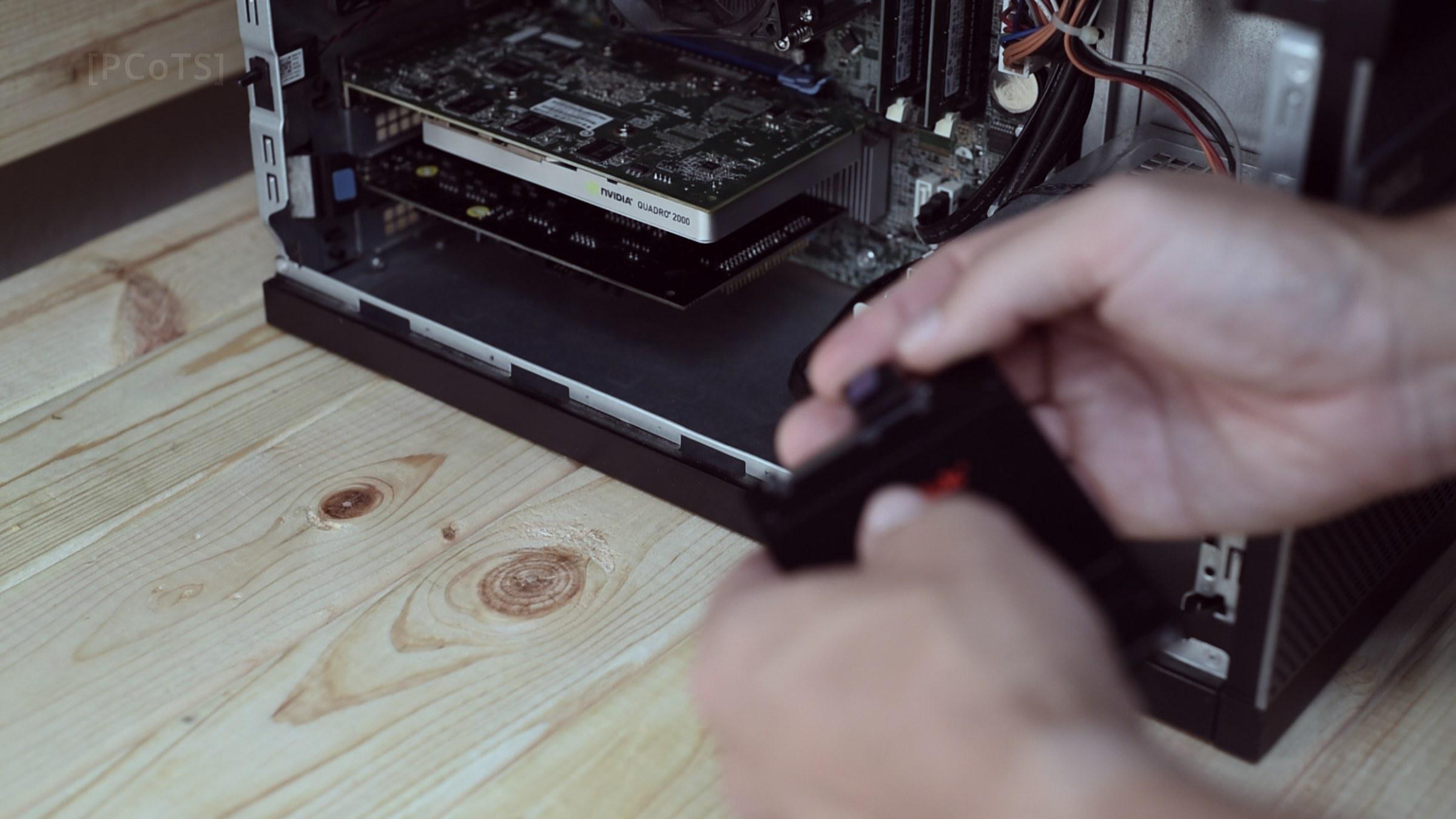 Sliding the SSD in on the tool-less drive caddy