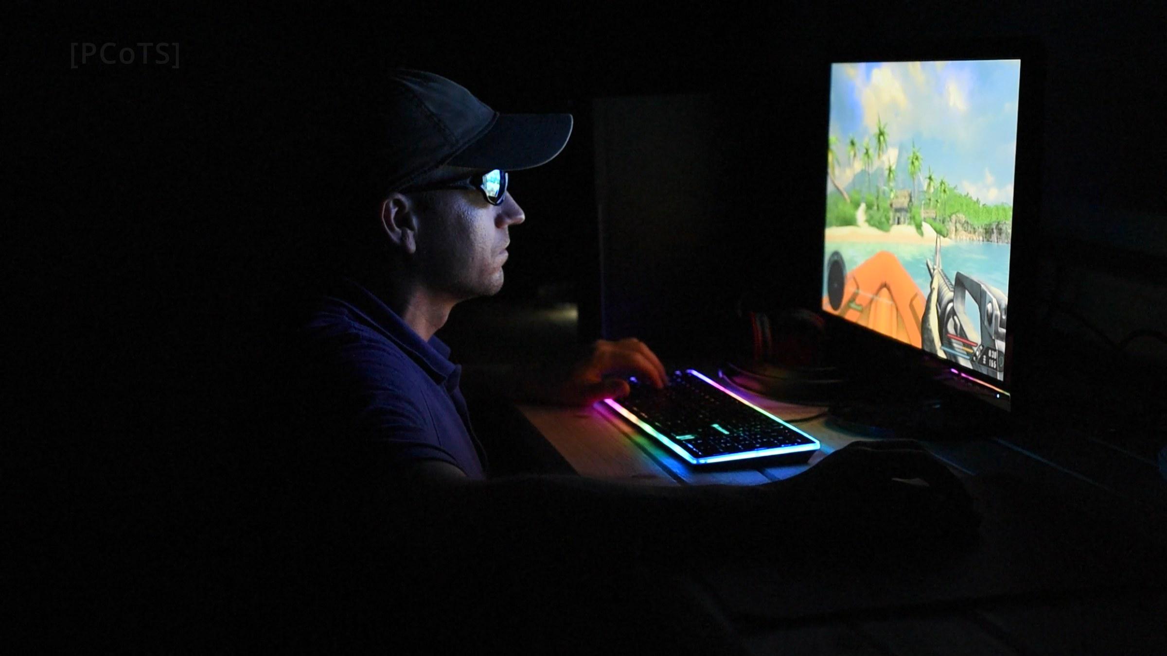 Playing Far Cry in a dark garage, lit by the RGB keyboard